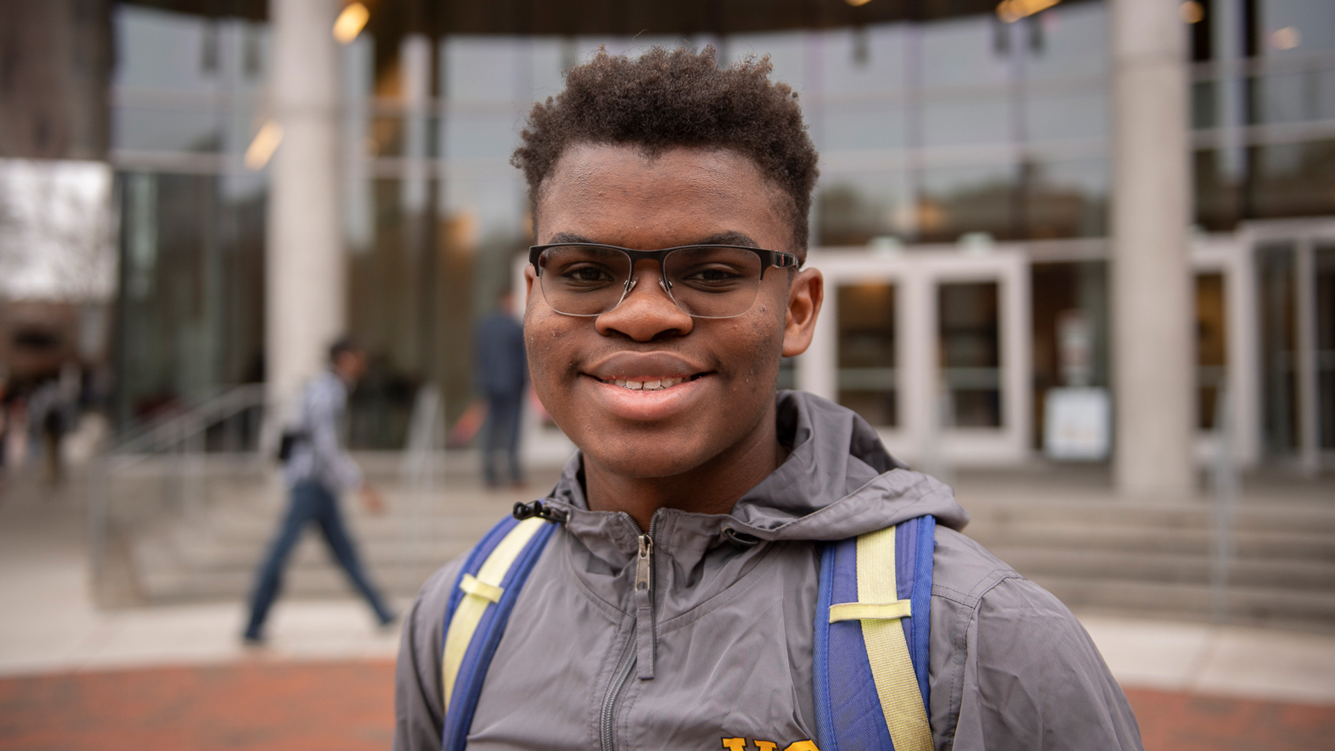 Student in front of Cabell Library